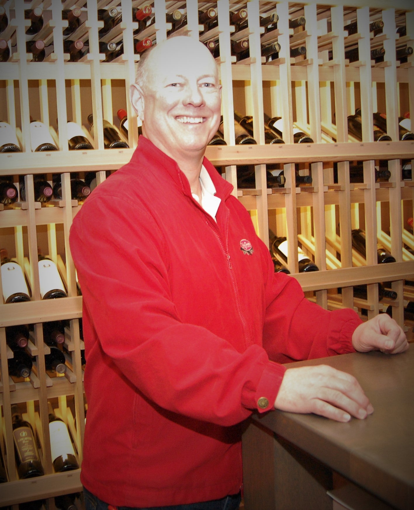 Jeff Hagen posing in a wine cellar
